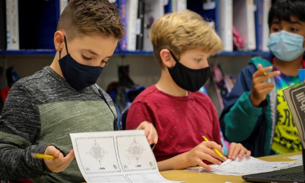 Students work on Escape Room problems